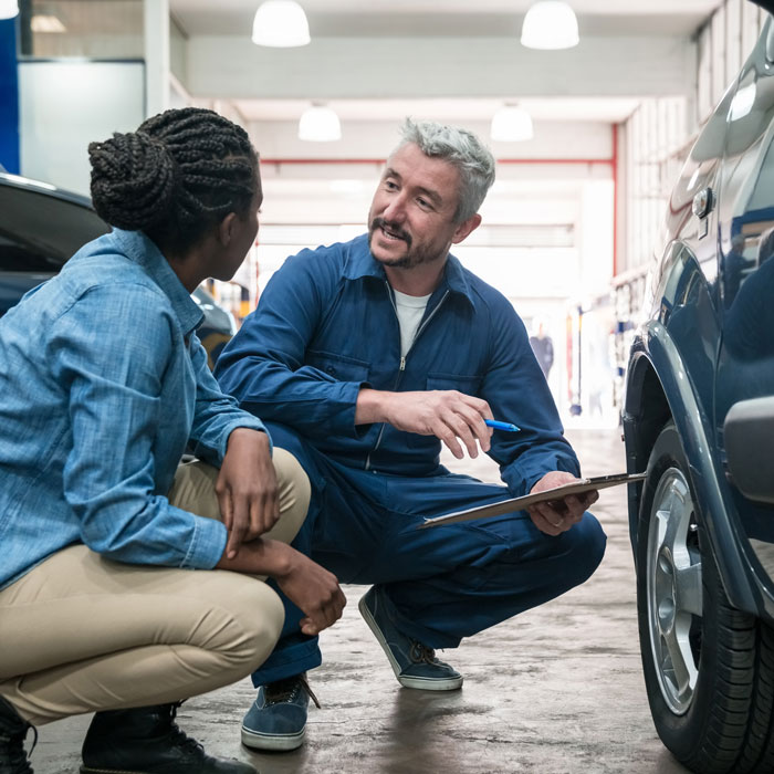 man explaining diagnostics to customer