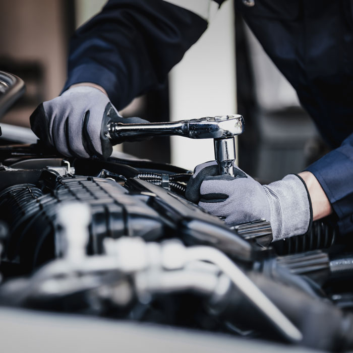 mechanic working on engine