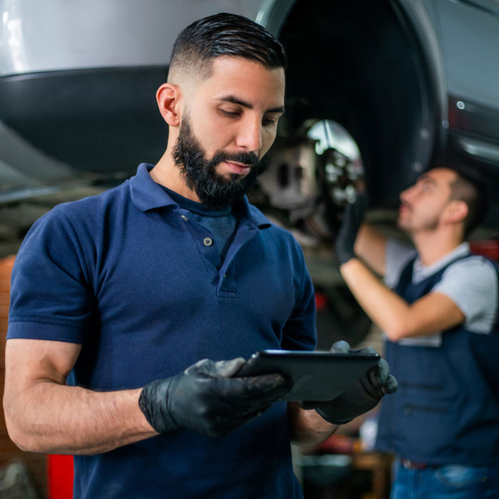 mechanic reviewing diagnostic report